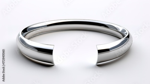 A photo of a sleek silver open cuff.