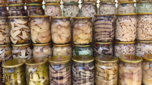 Wallpaper Mural Glass jars filled with canned mushrooms stand in rows, stacked on top of each other. Harvesting and preserving mushrooms for the winter. Torontodigital.ca