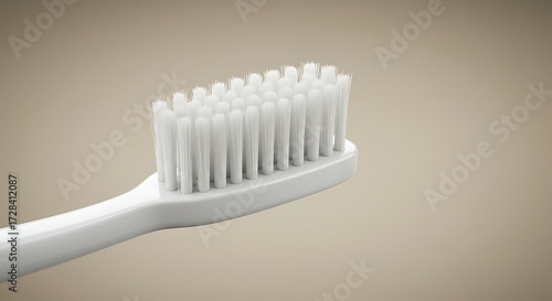 Close up of a clean white toothbrush on a neutral background
