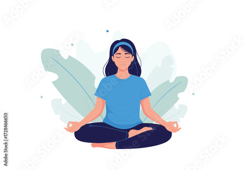 A woman meditates peacefully in a serene natural setting surrounded by lush green leaves.