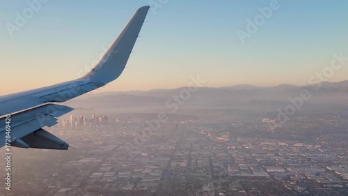 Window View From An Airplane Looking At Los Angeles City During Sunset