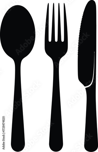Black spoon, fork, and knife on a dining
