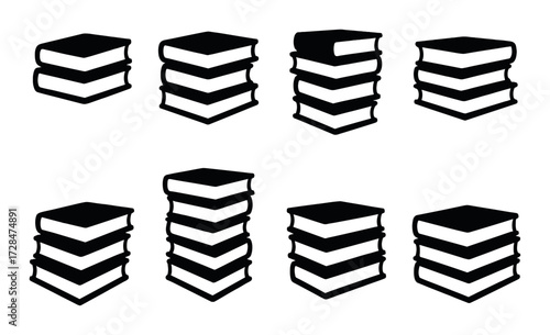 Eight stacks of black books on dark background