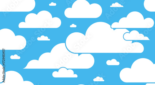 A vibrant blue sky filled with fluffy white cartoon clouds of various sizes.