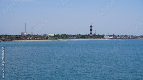 view of the beach and lighthouse