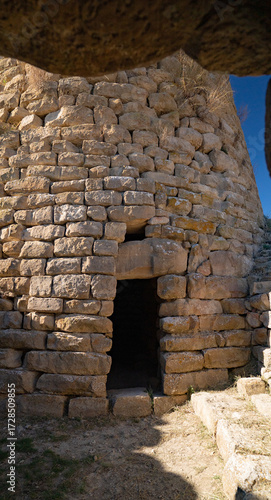 Photos Nuraghe Piscu megalithic stone tower ruins in Suelli, Sardinia, under clear blue