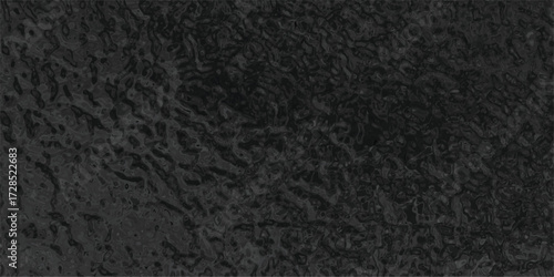 Detailed dark surface texture displaying a pattern of ripples and variations giving a dramatic look for creative design purposes