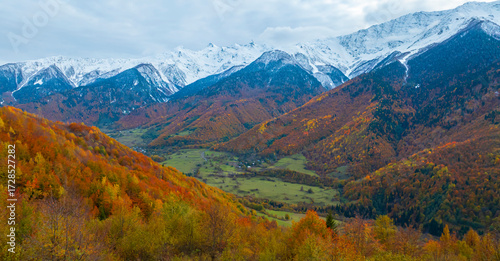Breath taking view of evening sunset scene a mountain in  Autumn scene with snow at Mestia Georgia, autumn forest