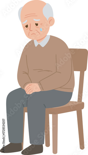 An elderly man sits on a wooden chair, looking sad with tears on his face.
