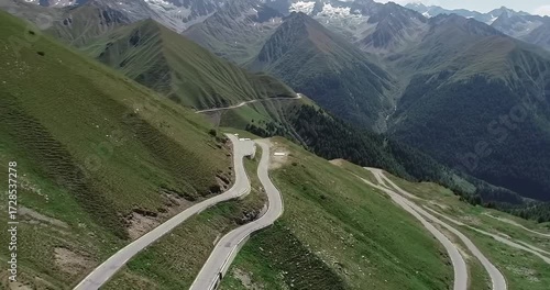 Scenic winding mountain road with lush green hills