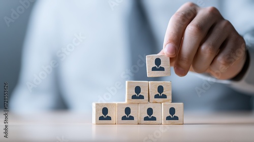Hand Building Business Person Wooden Block Hierarchy - Leadership and Talent Pipeline