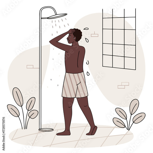 African man taking shower in the bathroom
