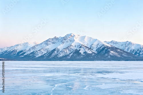 Wallpaper Mural Snow-capped mountains rise above a frozen lake under a clear blue sky Torontodigital.ca