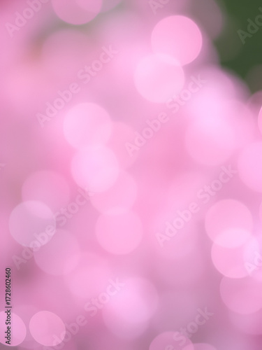 Bokeh orbs in soft pastel pink and lavender create a dreamy romantic abstract background with softly blurred pastels