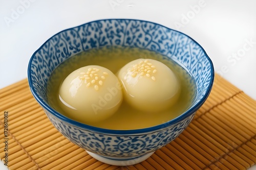 Chè trôi nước- round glutinous rice dumplings floating in a clear, slightly golden sweet syrup-Vietnamese traditional sweet soup