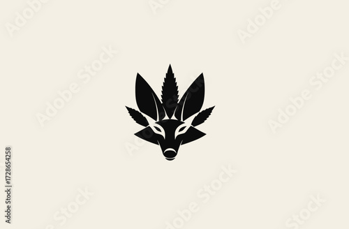 A minimalist black and white image features a fox face with a leaf-like design crown