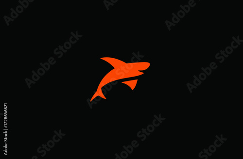Orange stylized shark on a black backdrop, graphic design, simple, modern logo