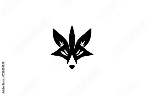 Stylized black fox head with leaf accents on a white background