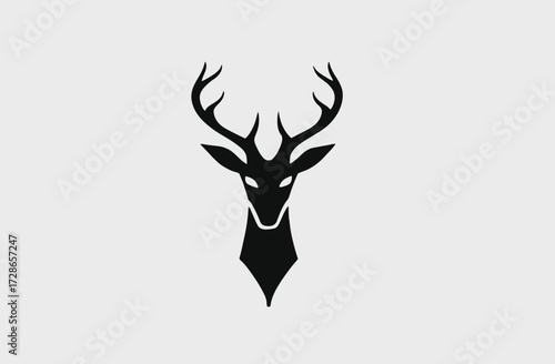 Simple vector illustration of a deer head with antlers, in a black silhouette