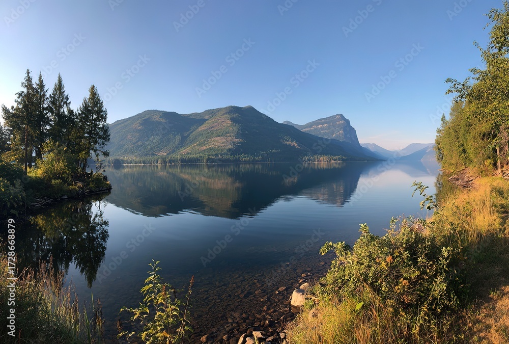 Obraz premium Lake and Mountain Forest Reflections under Clear Sky - Natural Landscape