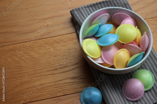 Wallpaper Mural Flying saucer UFO shape sweet colorful candies on wooden table Torontodigital.ca