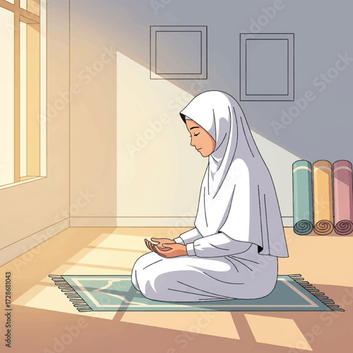 A woman in a white hijab is praying on a prayer rug in a room with sunlight.