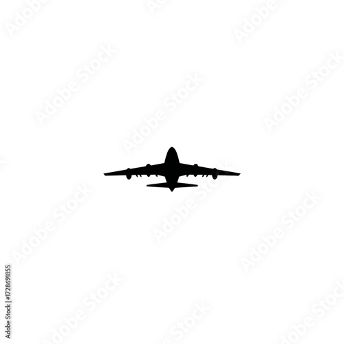 Silhouette of a wide-bodied, four-engine jet airliner viewed from below on white