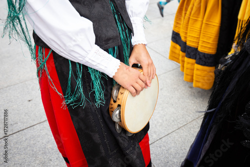 Galician musician holding a tambourine