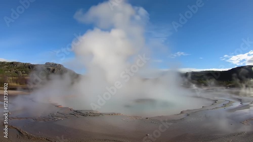 Breathtaking view of a geyser eruption in a geothermal landscape, Iceland
