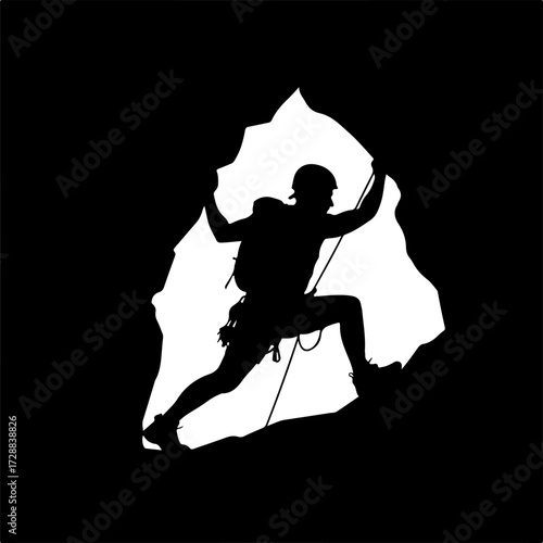 Silhouette of a Rock Climber Conquering Cave Entrance with Determination