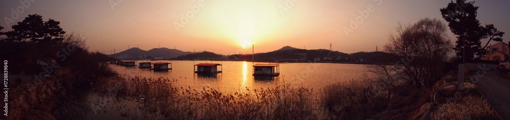 Fototapeta premium sunset over the river