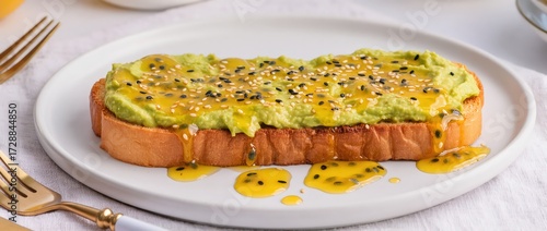 Healthy avocado toast with passion fruit pulp and sesame topping