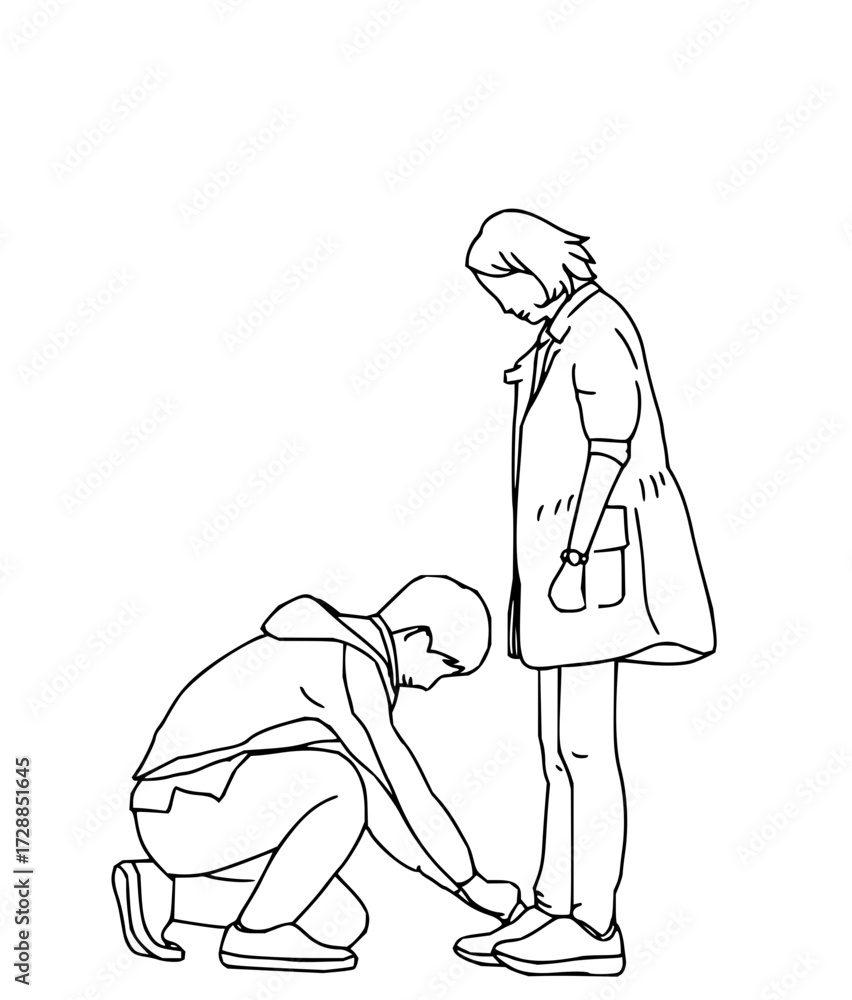 Fototapeta premium Caring man gently ties partner's shoelace showing affection and support in a moment of tenderness