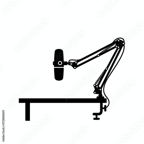Professional podcasting setup with a studio microphone on an adjustable boom arm clamped to a desk, perfect for broadcasts and voiceovers, capturing clear audio for content creators.