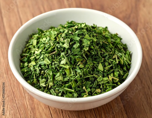 Dried chopped green herbs in a bowl