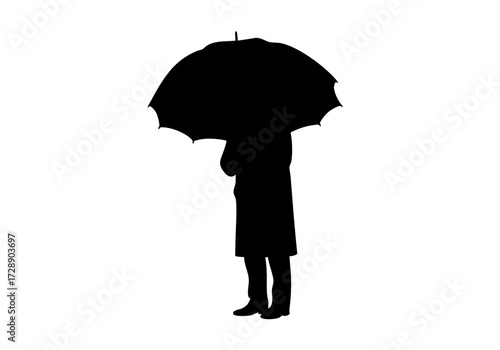 Silhouette of a person standing under an umbrella.