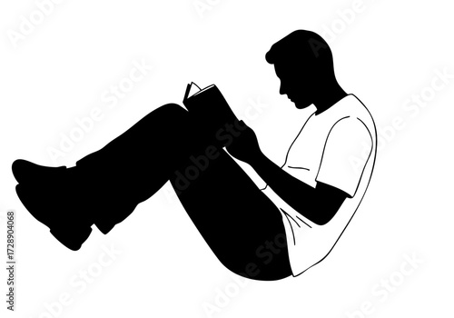 A person reading a book in a comfortable position.