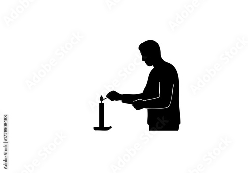 A person lights a candle in a moment of peace and tranquility.
