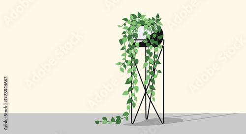 A lush green trailing plant cascades elegantly from a minimalist black metal plant stand.