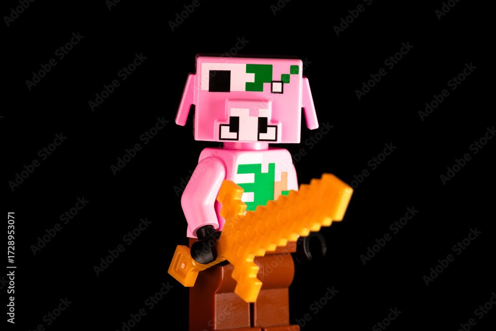 Naklejka premium LEGO Minecraft Zombie Piglin with a golden sword on a black background