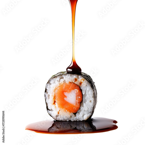 Drizzle drop of soy sauce drips from a fresh salmon with seaweed sushi roll. Traditional Japanese food
