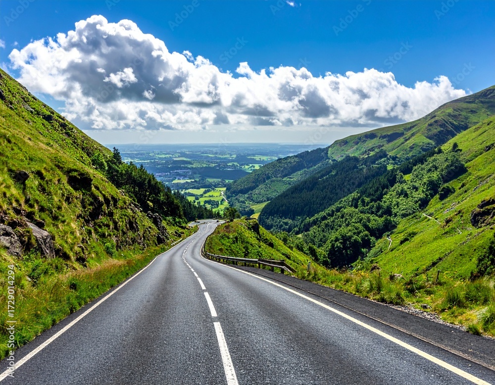 Fototapeta premium Winding Mountain Road Through Green Hills