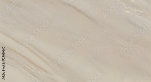 Subtle and sophisticated cream-colored marble background with delicate veining, embodying natural elegance and minimalist design