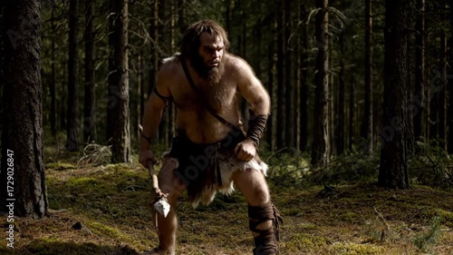 Prehistoric caveman hunter, dressed in animal furs, standing ready with a stone-tipped spear in a wild, ancient forest, representing human evolution and primitive survival