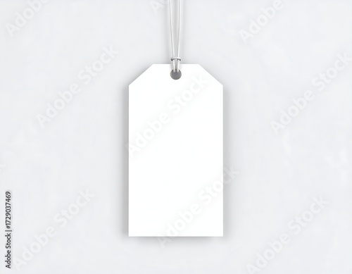 Blank price tag hangs from a string