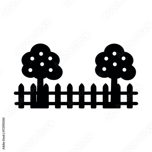 Simple silhouette of a picket fence with two fruit trees