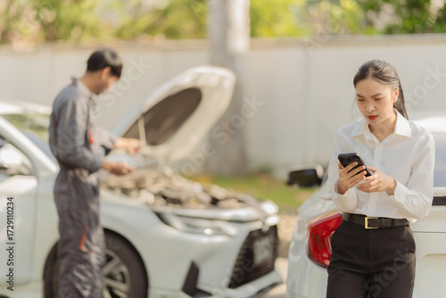 Asian woman on the phone asking for help in making an insurance claim after a car accident. Calling her insurance company for help.