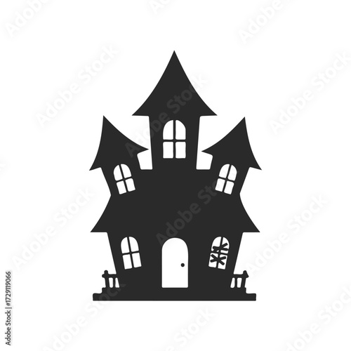Spooky silhouette of a haunted house with gnarled towers and windows