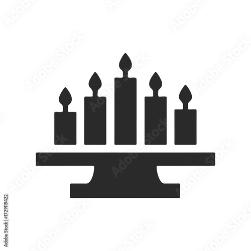 Black kwanzaa kinara symbol with five lit candles on white background