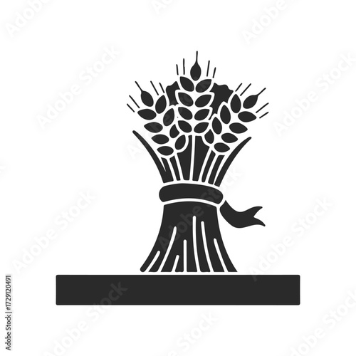 Monochrome wheat sheaf silhouette with ribbon on white background
